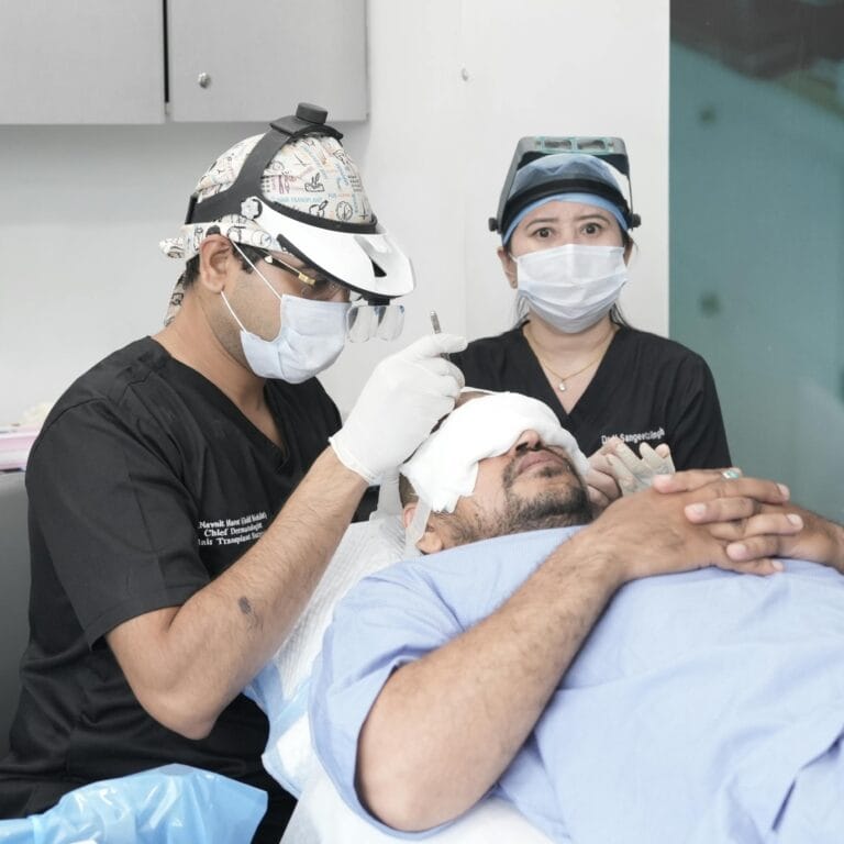Close-up of a specialized sapphire gemstone blade creating microscopic V-shaped channels in the scalp for a high-density hair transplant.